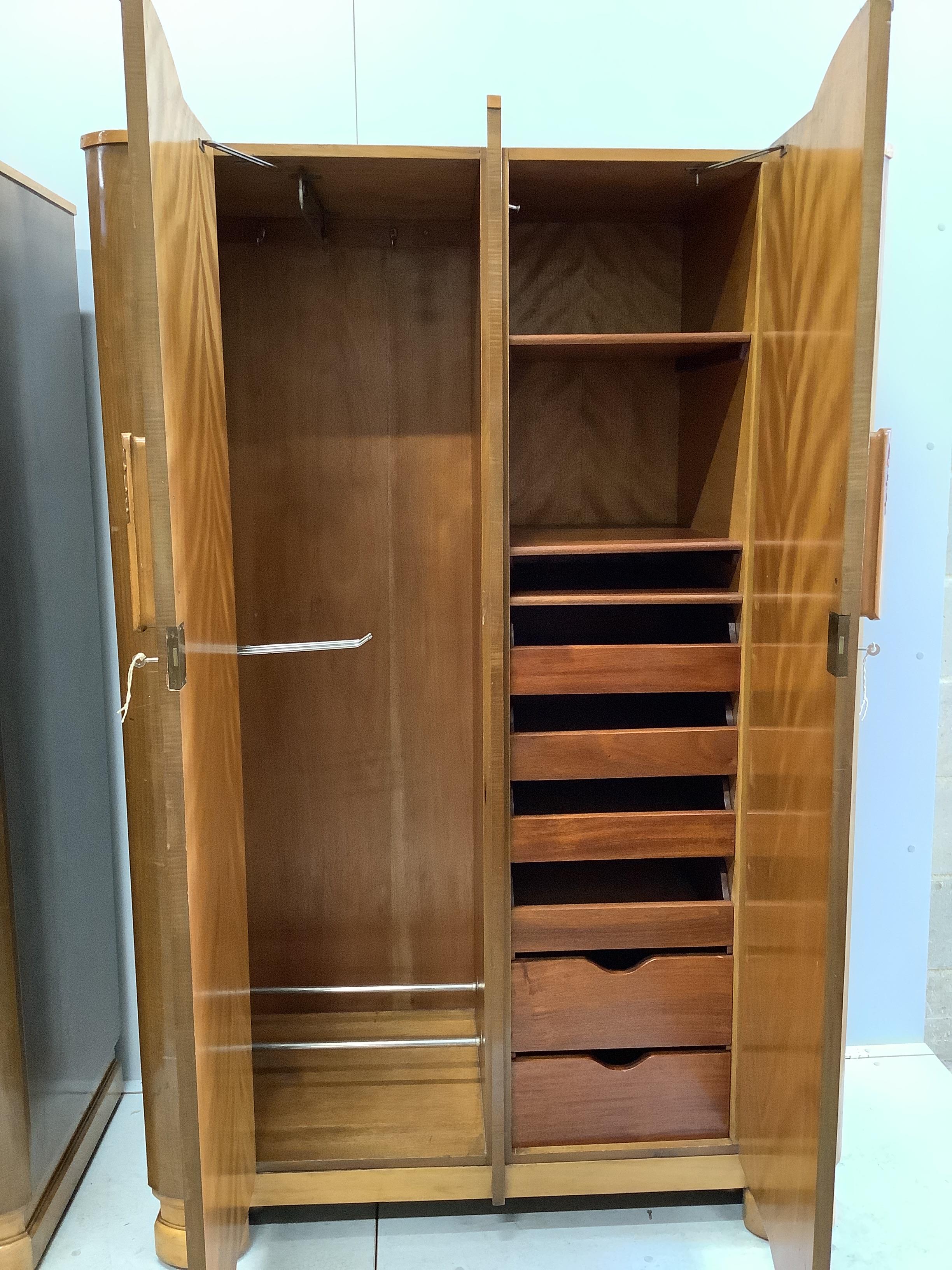 A pair of Art Deco walnut compactum wardrobes, width 116cm, depth 54cm, height 183cm